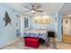 Bright bedroom with light blue walls, a comfortable bed, and ocean-themed decor at 351 Lake Arrowhead Rd. # 12-245, Myrtle Beach, SC 29572