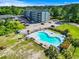 Community pool with lounge chairs and surrounding landscaping at 4015 Fairway Dr. # 103-A, Little River, SC 29566