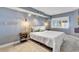 Main bedroom with king bed, wall-mounted TV, and coastal decor at 4800 S Ocean Blvd. # 412, North Myrtle Beach, SC 29582