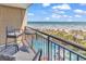 Relaxing balcony with ocean view, pool, and comfortable seating at 4800 S Ocean Blvd. # 412, North Myrtle Beach, SC 29582