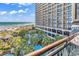 Spacious balcony overlooks the ocean, pool, and resort at 4800 S Ocean Blvd. # 412, North Myrtle Beach, SC 29582