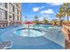 Resort-style pool with a mushroom water feature and lounge chairs at 4800 S Ocean Blvd. # 412, North Myrtle Beach, SC 29582