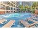 Relaxing pool area with multiple lounge chairs at 4800 S Ocean Blvd. # 412, North Myrtle Beach, SC 29582