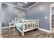 Cozy bedroom with a rustic bed frame and grey walls at 604 Mcclain Ct., Conway, SC 29526