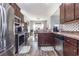 Modern kitchen features stainless steel appliances and ample cabinetry at 604 Mcclain Ct., Conway, SC 29526