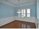 Formal dining room with hardwood floors and wainscoting at 64 Summerlight Dr., Murrells Inlet, SC 29576