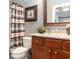 Clean bathroom with granite countertop, wooden vanity, and shower at 646 Uniola Dr., Myrtle Beach, SC 29579