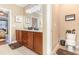 Double vanity bathroom with granite countertop and additional toilet at 646 Uniola Dr., Myrtle Beach, SC 29579
