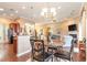 Open dining area with a marble table and chairs, adjacent to the kitchen and living room at 646 Uniola Dr., Myrtle Beach, SC 29579