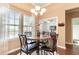 Dining area with a marble-top table and four chairs, near the kitchen at 646 Uniola Dr., Myrtle Beach, SC 29579