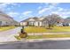 One-story home with stone accents, a large yard, and a two-car garage at 646 Uniola Dr., Myrtle Beach, SC 29579