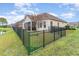 House exterior showcasing a fenced yard and water view at 646 Uniola Dr., Myrtle Beach, SC 29579