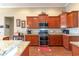 Well-equipped kitchen offering wood cabinets and granite countertops at 646 Uniola Dr., Myrtle Beach, SC 29579