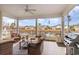 Relaxing screened porch overlooking a pond with wicker furniture at 646 Uniola Dr., Myrtle Beach, SC 29579