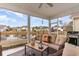 Screened porch with wicker furniture and view of pond and houses at 646 Uniola Dr., Myrtle Beach, SC 29579