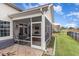 Relaxing screened porch with patio, grill, and water view at 646 Uniola Dr., Myrtle Beach, SC 29579