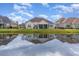 Home's reflection in the water, showcasing its exterior at 646 Uniola Dr., Myrtle Beach, SC 29579