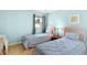 Small bedroom with twin beds, nightstand, and light colored walls at 650 Tupelo Ln. # 5-F, Longs, SC 29568