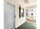 Apartment hallway with a green door and a view of another building at 650 Tupelo Ln. # 5-F, Longs, SC 29568