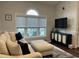 Spacious living room with large window, comfortable seating and a TV at 695 Riverwalk Dr. # 5-302, Myrtle Beach, SC 29579