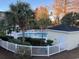 Community outdoor pool with surrounding landscaping and patio at 695 Riverwalk Dr. # 5-302, Myrtle Beach, SC 29579