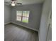 Well-lit bedroom featuring a large window and hardwood flooring at Tbb 2 Pee Dee Hwy., Conway, SC 29527