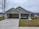 House exterior features a two-car garage and well-manicured lawn at Tbb 1 Pee Dee Hwy., Conway, SC 29527