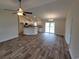 Open living room and kitchen with vinyl plank flooring at Tbb 1 Pee Dee Hwy., Conway, SC 29527