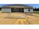 Home's rear elevation showcasing a patio and yard at Tbd 2 Mineral Springs Rd., Conway, SC 29527