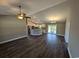 Open floor plan living room with dark flooring and kitchen island at Tbd 2 Mineral Springs Rd., Conway, SC 29527