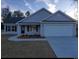 Newly constructed home with gray siding, two-car garage, and landscaping at Tbd 3 Mineral Springs Rd., Conway, SC 29527