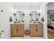 Bathroom with double vanity, marble flooring, and modern fixtures at 100 Boundary Loop Rd. Nw, Calabash, NC 28467