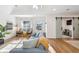 Open living room with sliding barn doors and natural light at 100 Boundary Loop Rd. Nw, Calabash, NC 28467