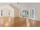 Spacious living room with vaulted ceiling, hardwood floors, and access to a sunroom at 106 Moss Circle, Conway, SC 29526