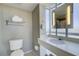 Clean and functional bathroom with white fixtures and tiled floor at 107 S Ocean Blvd. # 701, Myrtle Beach, SC 29577