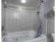 Bathroom with tiled shower, bathtub, and updated fixtures at 107 S Ocean Blvd. # 701, Myrtle Beach, SC 29577