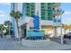 Entrance to the Oceans One Resort with palm trees at 107 S Ocean Blvd. # 701, Myrtle Beach, SC 29577