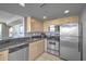 Compact kitchen featuring stainless steel appliances and granite countertops at 107 S Ocean Blvd. # 701, Myrtle Beach, SC 29577