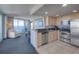 Kitchen with stainless steel appliances, granite countertops, and ocean view at 107 S Ocean Blvd. # 701, Myrtle Beach, SC 29577