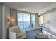 Living room with balcony access, ocean views, and white furniture at 107 S Ocean Blvd. # 701, Myrtle Beach, SC 29577