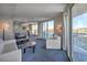 Living room with white furniture, ocean view, and access to the dining area at 107 S Ocean Blvd. # 701, Myrtle Beach, SC 29577