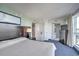 Main bedroom with attached bathroom and large windows at 107 S Ocean Blvd. # 701, Myrtle Beach, SC 29577