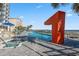 Resort pool with hot tub and a large orange number one sculpture at 107 S Ocean Blvd. # 701, Myrtle Beach, SC 29577