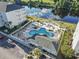 Aerial view of resort-style pool, hot tub, and sundeck overlooking a tranquil river at 1100 Commons Blvd. # 716, Myrtle Beach, SC 29572