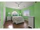 Bedroom with a queen bed and light green walls at 1100 Commons Blvd. # 716, Myrtle Beach, SC 29572