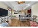 Open concept living space with hardwood floors, comfortable seating, and kitchen views at 1100 Commons Blvd. # 716, Myrtle Beach, SC 29572