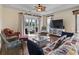 Spacious living area featuring hardwood floors, comfy seating, and a large TV at 1100 Commons Blvd. # 716, Myrtle Beach, SC 29572