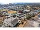 Aerial view of the condo complex with a pool, tennis court, and parking at 1100 Possum Trot Rd. # E235, North Myrtle Beach, SC 29582