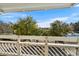 Balcony view overlooking tennis courts and trees at 1100 Possum Trot Rd. # E235, North Myrtle Beach, SC 29582