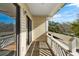Private balcony with wooden floor and partial views at 1100 Possum Trot Rd. # E235, North Myrtle Beach, SC 29582